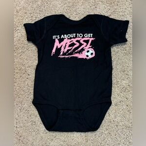 Rabbit Skins Messi Black Onesie, size 18 months. Only worn once.